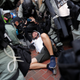 Riot police detain an anti-government protester during a demonstration at Wan Chai district, on China's National Day in Hong Kong, China October 1, 2019.